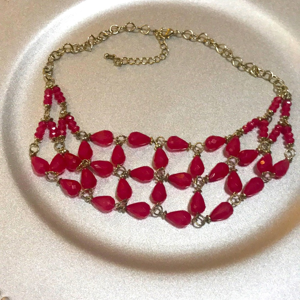 A pink red beaded necklace